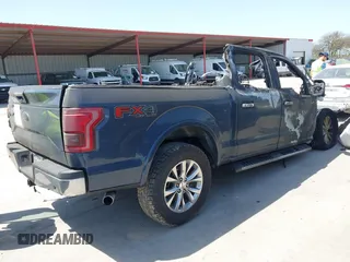 2015 Ford F-150 XLT with VIN 1FTEW1EG0FKE58666, listed as a IAAI auction lot 41803508 with 185,817 mi miles. Bid and sale history available at carsss.com. Image 4.