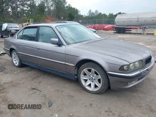 1998 BMW 7 Series 740il with VIN WBAGJ8323WDM23239, listed as a IAAI auction lot 41512630 with 221,673 mi miles. Bid and sale history available at carsss.com. Image 1.