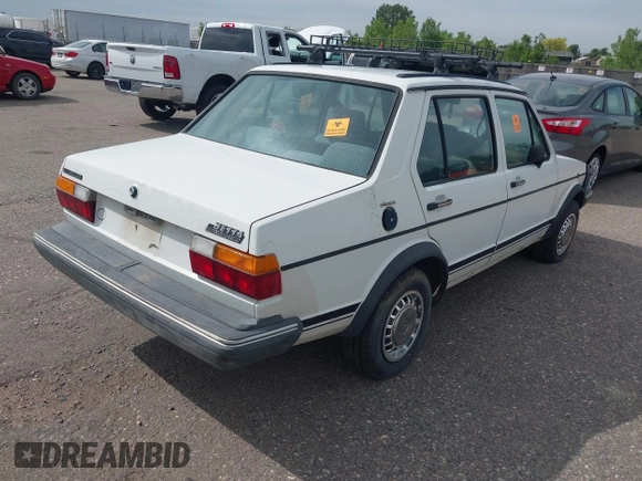 1982 Volkswagen Jetta z VIN WVWGA9161CW521961, wystawiony jako IAAI lot #42373314 z przebiegiem 52 051 mil mil oraz . Historia ofert i sprzedaży dostępna na DreamBid. Obrazek 4.