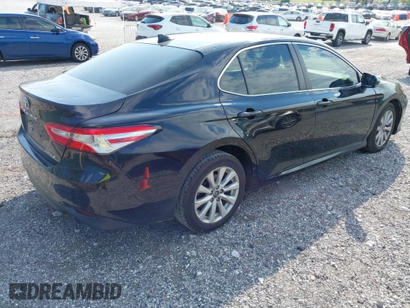 2019 Toyota Camry LE with VIN 4T1B11HK1KU718374, listed as a IAAI auction lot 42071905 with 86,460 mi miles and . Bid and sale history available at DreamBid. Image 4.