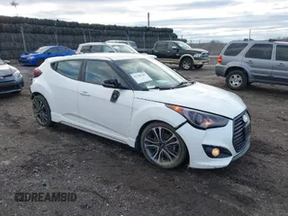 2016 Hyundai Veloster Turbo with VIN KMHTC6AE1GU264876, listed as a IAAI auction lot 41706399 with 136,954 mi miles. Bid and sale history available at carsss.com. Image 1.