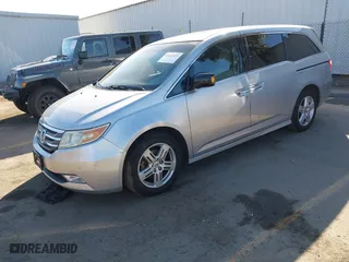 2011 Honda Odyssey Touring with VIN 5FNRL5H9XBB012899, listed as a IAAI auction lot 41611879 with 171,041 mi miles. Bid and sale history available at carsss.com. Image 17.