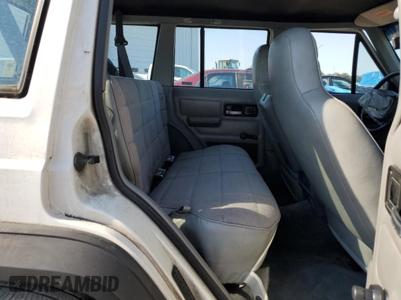 1996 Jeep Cherokee Sport with VIN 1J4FT68S0TL120534, listed as a Copart auction lot 74806974 with 284,147 mi miles and Non Repairable. Bid and sale history available at carsss.com. Image 11.