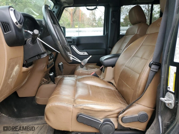 2011 Jeep Wrangler Unlimited Sahara with VIN 1J4BA5H16BL557068, listed as a Copart auction lot 80429454 with 142,428 mi miles and Salvage Title. Bid and sale history available at carsss.com. Image 7.