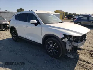 2018 Mazda CX-5 Touring z VIN JM3KFACM7J0370737, wystawiony jako Copart lot #60113725 z przebiegiem 131 385 mil mil oraz Szkoda całkowita • Salvage title. Historia ofert i sprzedaży dostępna na DreamBid. Obrazek 4.