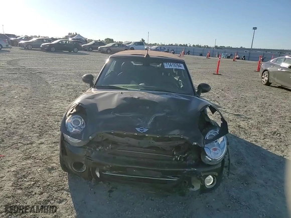 2015 MINI Cooper Convertible with VIN WMWZN3C53FT862859, listed as a Copart auction lot 71419764 with 113,356 mi miles and Salvage Title. Bid and sale history available at carsss.com. Image 11.