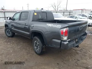 2022 Toyota Tacoma SR with VIN 3TMCZ5AN4NM476170, listed as a IAAI auction lot 41482149 with 57,126 mi miles and . Bid and sale history available at DreamBid. Image 3.