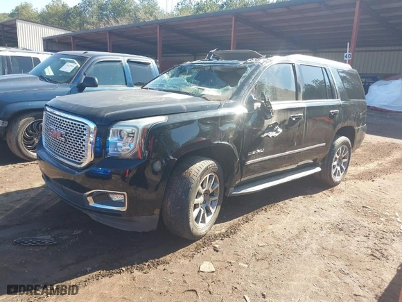 2016 GMC Yukon Denali with VIN 1GKS1CKJ2GR128618, listed as a IAAI auction lot 40009657 with 175,776 mi miles. Bid and sale history available at carsss.com. Image 2.