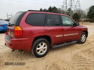 2004 GMC Envoy SLT with VIN 1GKDT13S342262833, listed as a Copart auction lot 87828975 with 203,404 mi miles and Salvage Title. Bid and sale history available at carsss.com. Image 3.