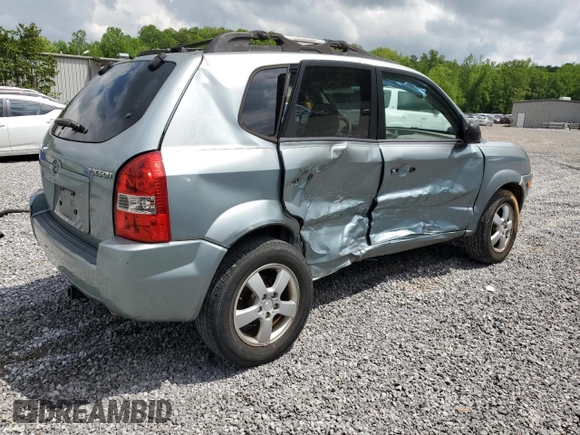 2005 Hyundai Tucson GL with VIN KM8JM12B05U148660, listed as a Copart auction lot 54302805 with 257,233 mi miles and Salvage title. Bid and sale history available at DreamBid. Image 3.
