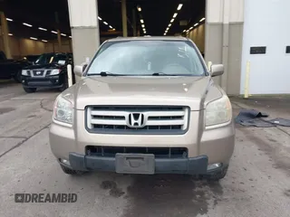 2006 Honda Pilot EX-L with VIN 2HKYF18516H528116, listed as a IAAI auction lot 41782324 with 245,280 mi miles and . Bid and sale history available at DreamBid. Image 12.