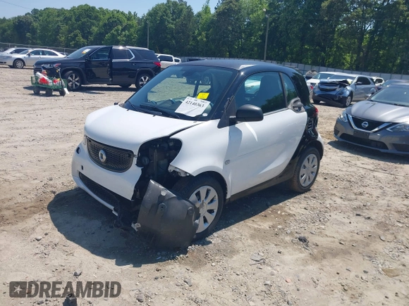 2016 Smart fortwo Passion z VIN WMEFJ5DA6GK078340, wystawiony jako IAAI lot #42140363 z przebiegiem 114 647 mil mil oraz . Historia ofert i sprzedaży dostępna na DreamBid. Obrazek 6.