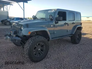 2014 Jeep Wrangler Unlimited Rubicon with VIN 1C4HJWFG9EL199501, listed as a Copart auction lot 61443595 with 86,940 mi miles and Salvage title. Bid and sale history available at DreamBid. Image 1.