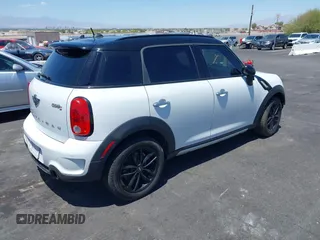 2015 MINI Countryman S with VIN WMWZC3C58FWT05613, listed as a IAAI auction lot 42374870 with 124,214 mi miles and . Bid and sale history available at DreamBid. Image 4.