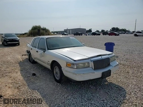 1997 Lincoln Town Car Signature z VIN 1LNLM82W9VY681894, wystawiony jako Copart lot #71467034 z przebiegiem 129 142 mil mil oraz Szkody całkowita. Historia ofert i sprzedaży dostępna na DreamBid. Obrazek 11.