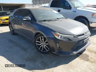 2014 Scion tC with VIN JTKJF5C74E3085237, listed as a IAAI auction lot 41788862 with 106,807 mi miles. Bid and sale history available at carsss.com. Image 1.