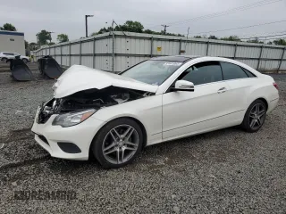 2015 Mercedes-Benz E 400 with VIN WDDKJ6HBXFF300283, listed as a Copart auction lot 57441065 with 86,669 mi miles and Salvage title. Bid and sale history available at DreamBid. Image 1.