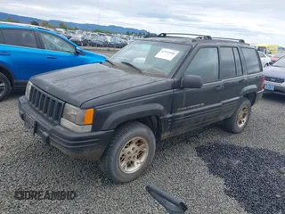 1998 Jeep Grand Cherokee Limited with VIN 1J4GZ78YXWC141912, listed as a IAAI auction lot 41972948 with 291,801 mi miles. Bid and sale history available at carsss.com. Image 2.