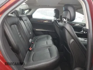 2016 Lincoln MKZ z VIN 3LN6L2J95GR605230, wystawiony jako Copart lot #57844905 z przebiegiem 95 530 mil mil oraz Czysty tytuł • Clean title. Historia ofert i sprzedaży dostępna na DreamBid. Obrazek 10.