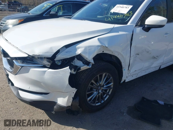2017 Mazda CX-5 Touring z VIN JM3KFBCL8H0214052, wystawiony jako IAAI lot #41940783 z przebiegiem 120 083 mil mil oraz . Historia ofert i sprzedaży dostępna na DreamBid. Obrazek 6.
