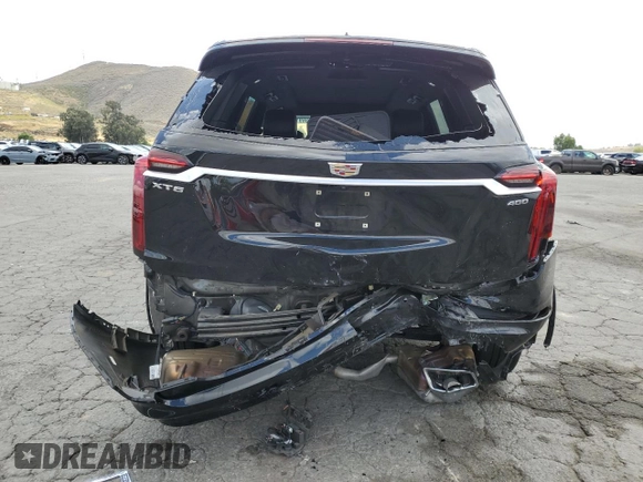 2023 Cadillac XT6 FWD Premium Luxury with VIN 1GYKPCRS5PZ220616, listed as a Copart auction lot 56913725 with 25,860 mi miles and Salvage title. Bid and sale history available at DreamBid. Image 6.