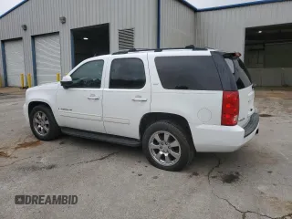 2009 GMC Yukon SLT w/4SA with VIN 1GKEC33349R265859, listed as a Copart auction lot 74012784 with 153,394 mi miles and Clean Title. Bid and sale history available at carsss.com. Image 2.