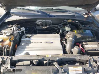 2006 Ford Escape Hybrid with VIN 1FMCU96H76KA56562, listed as a IAAI auction lot 42096713 with 148,963 mi miles. Bid and sale history available at carsss.com. Image 10.