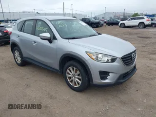 2016 Mazda CX-5 Sport z VIN JM3KE4BY1G0711602, wystawiony jako IAAI lot #42537627 z przebiegiem Nie podano mil oraz . Historia ofert i sprzedaży dostępna na DreamBid. Obrazek 1.