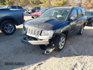 2014 Jeep Compass Latitude with VIN 1C4NJCEB3ED560058, listed as a IAAI auction lot 41470125 with 116,319 mi miles. Bid and sale history available at carsss.com. Image 2.