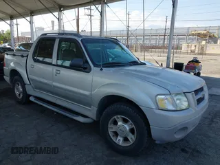 2003 Ford Explorer Sport Trac XLS z VIN 1FMZU67EX3UB37102, wystawiony jako IAAI lot #42129030 z przebiegiem 145 919 mil mil oraz . Historia ofert i sprzedaży dostępna na DreamBid. Obrazek 1.