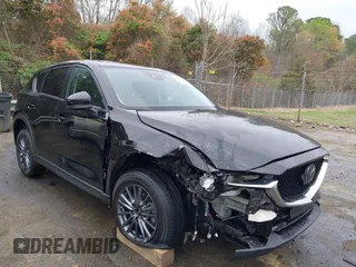 2020 Mazda CX-5 Touring with VIN JM3KFACM9L0770933, listed as a IAAI auction lot 41921464 with 75,997 mi miles. Bid and sale history available at carsss.com. Image 1.