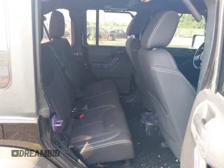 2014 Jeep Wrangler Unlimited Sahara with VIN 1C4BJWEG6EL217945, listed as a IAAI auction lot 42388477 with 61,739 mi miles and . Bid and sale history available at DreamBid. Image 8.