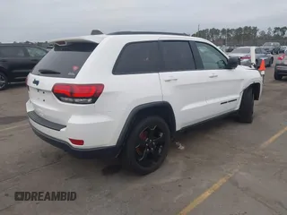 2018 Jeep Grand Cherokee Laredo E with VIN 1C4RJFAG2JC503130, listed as a IAAI auction lot 41527333 with 95,669 mi miles. Bid and sale history available at carsss.com. Image 4.