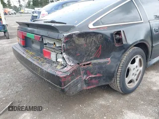 1986 Nissan 300ZX z VIN JN1HZ14S4GX140955, wystawiony jako IAAI lot #41935505 z przebiegiem 144 917 mil mil oraz . Historia ofert i sprzedaży dostępna na DreamBid. Obrazek 14.