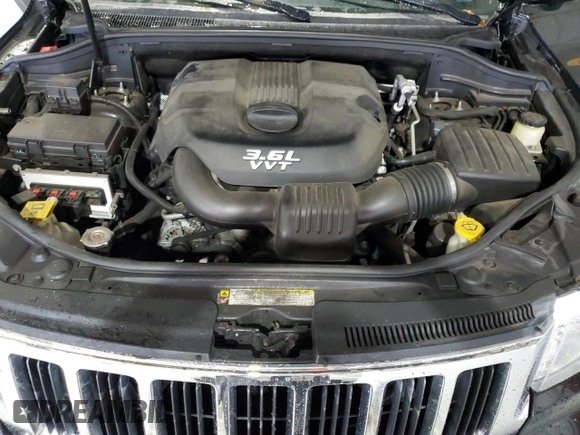2012 Jeep Grand Cherokee Laredo with VIN 1C4RJEAG4CC146160, listed as a Copart auction lot 87515345 with 116,936 mi miles and Salvage Title. Bid and sale history available at carsss.com. Image 13.