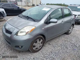 2010 Toyota Yaris with VIN JTDKT4K38A5296999, listed as a IAAI auction lot 41878127 with 122,692 mi miles. Bid and sale history available at carsss.com. Image 2.