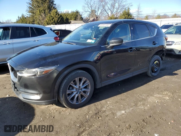 2019 Mazda CX-5 Grand Touring with VIN JM3KFBDM0K0571806, listed as a Copart auction lot 43395105 with 57,768 mi miles and Salvage Title. Bid and sale history available at carsss.com. Image 1.