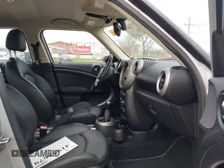 2011 MINI Countryman S with VIN WMWZC5C51BWM10385, listed as a IAAI auction lot 41952679 with 112,008 mi miles and . Bid and sale history available at DreamBid. Image 5.