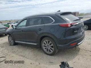 2021 Mazda CX-9 Carbon Edition z VIN JM3TCADY9M0514372, wystawiony jako Copart lot #52902555 z przebiegiem 99 812 mil mil oraz Szkoda całkowita • Salvage title. Historia ofert i sprzedaży dostępna na DreamBid. Obrazek 2.