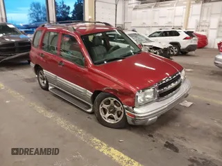 2001 Chevrolet Tracker LT z VIN 2CNBJ634X16953830, wystawiony jako IAAI lot #41072558 z przebiegiem 85 596 mil mil oraz . Historia ofert i sprzedaży dostępna na DreamBid. Obrazek 1.