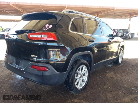 2015 Jeep Cherokee Latitude with VIN 1C4PJLCB8FW669150, listed as a IAAI auction lot 42122669 with 194,525 mi miles and . Bid and sale history available at DreamBid. Image 4.