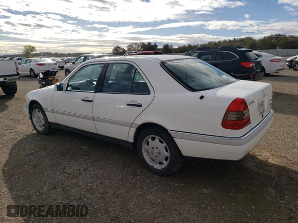 1995 Mercedes-Benz C with VIN WDBHA28E1SF151911, listed as a Copart auction lot 76814424 with 128,184 mi miles and Clean Title. Bid and sale history available at carsss.com. Image 2.