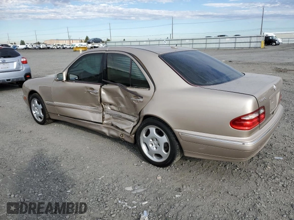 2001 Mercedes-Benz E-Class with VIN WDBJF70JX1B220786, listed as a Copart auction lot 71808344 with 94,476 mi miles and Salvage Title. Bid and sale history available at carsss.com. Image 2.