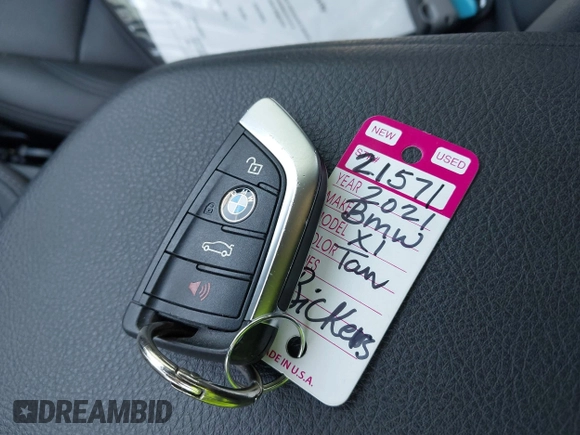 2021 BMW X1 sDrive28i with VIN WBXJG7C06M5T14235, listed as a IAAI auction lot 42021762 with 53,384 mi miles and . Bid and sale history available at DreamBid. Image 11.