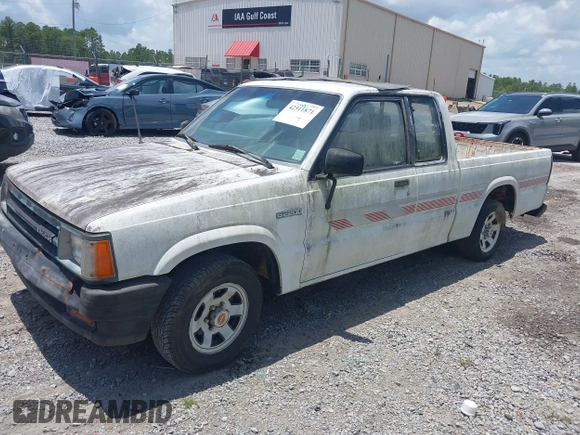 1991 Mazda B-Series Truck z VIN JM2UF3133M0169084, wystawiony jako IAAI lot #42511871 z przebiegiem 175 426 mil mil oraz . Historia ofert i sprzedaży dostępna na DreamBid. Obrazek 2.