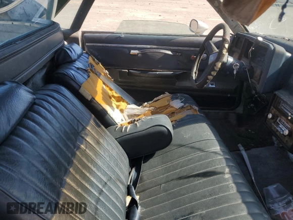 1982 Chevrolet El Camino z VIN 1GCCW80K1CR129344, wystawiony jako Copart lot #77126034 z przebiegiem 295 869 mil mil oraz Szkoda całkowita • Salvage title. Historia ofert i sprzedaży dostępna na DreamBid. Obrazek 7.
