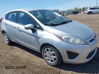 2013 Ford Fiesta SE with VIN 3FADP4EJ9DM157685, listed as a IAAI auction lot 42145511 with 101,331 mi miles. Bid and sale history available at carsss.com. Image 1.