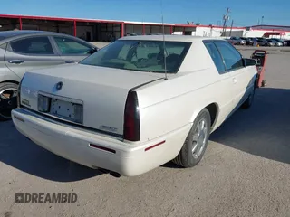 2000 Cadillac Eldorado Touring ETC z VIN 1G6ET1292YU188056, wystawiony jako IAAI lot #41671661 z przebiegiem 139 138 mil mil oraz . Historia ofert i sprzedaży dostępna na DreamBid. Obrazek 4.