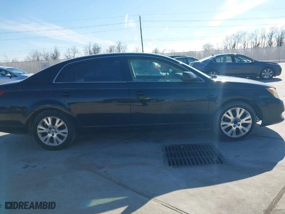 2009 Toyota Avalon XL with VIN 4T1BK36B89U335604, listed as a IAAI auction lot 41328877 with 166,396 mi miles. Bid and sale history available at carsss.com. Image 13.