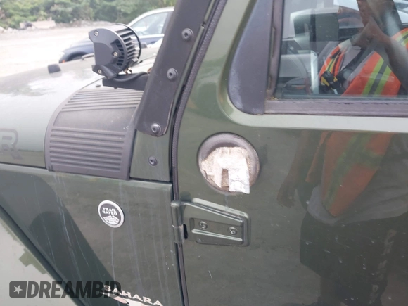 2008 Jeep Wrangler Sahara with VIN 1J4FA54118L653044, listed as a IAAI auction lot 42557244 with 152,072 mi miles and . Bid and sale history available at DreamBid. Image 17.